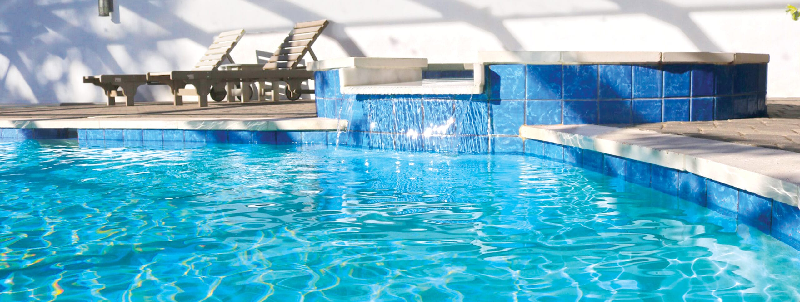 Elevated spa on inground Birmingham pool.