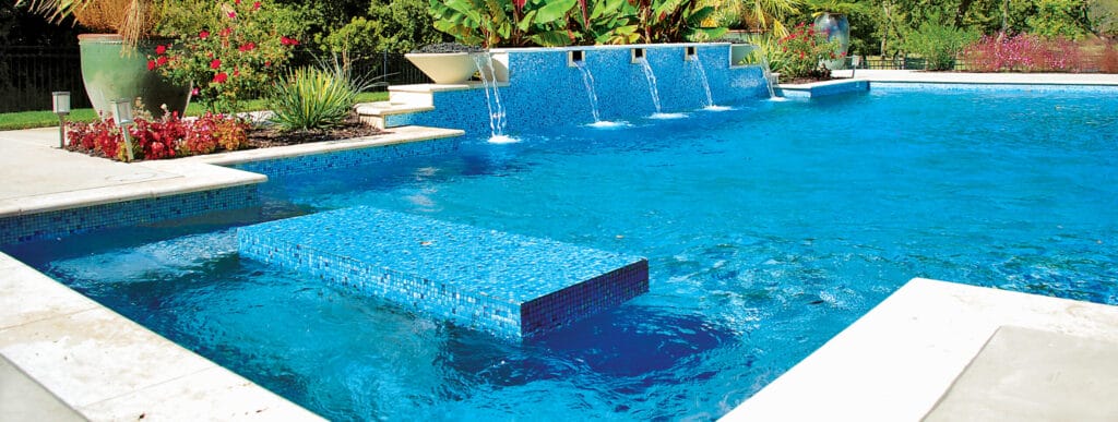 Geometric custom pool with water bowls and swim-up table. in Oklahoma.