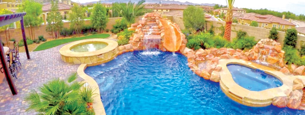 Rock waterfalls and spa on custom swimming pool in Laughlin.