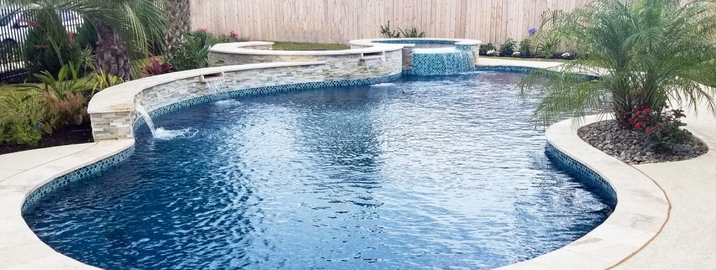 Free-form pool in Houston with cascade water features.
