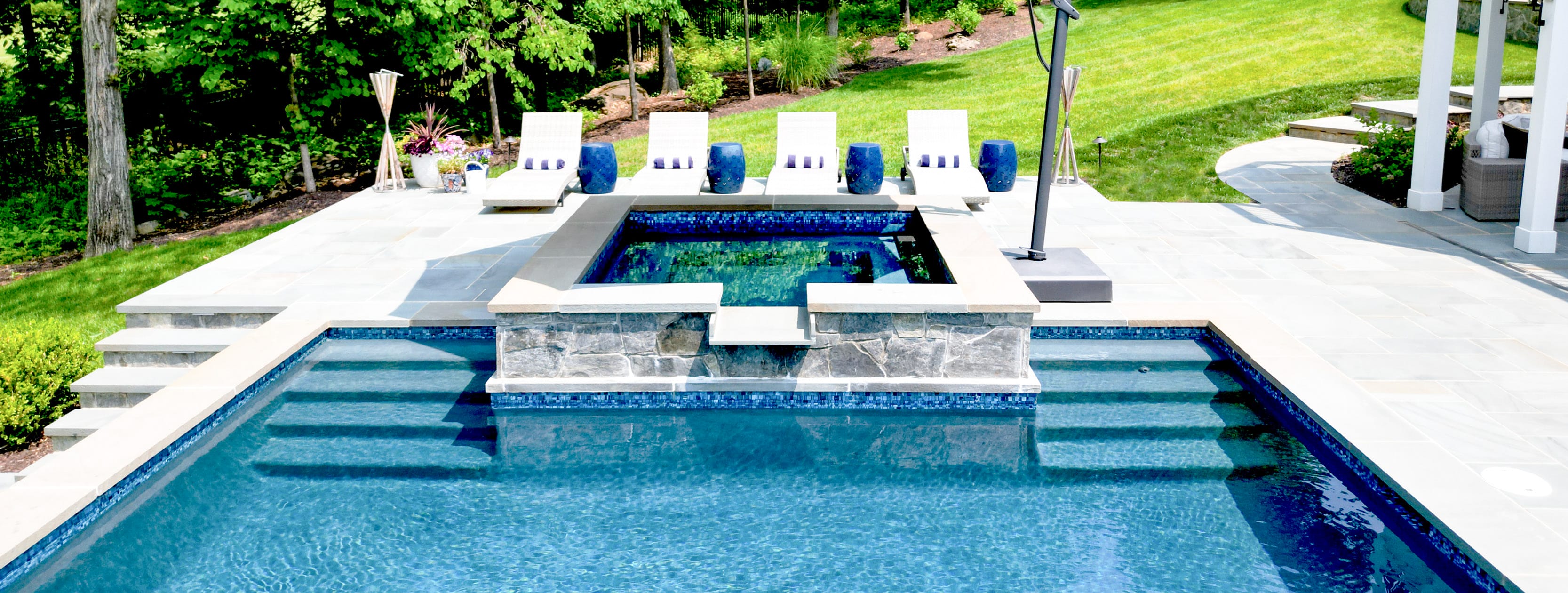 Elevated, square-shaped spa on Maryland gunite pool.