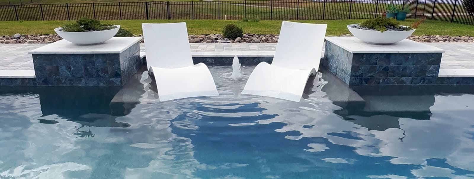 Sun ledge and pilaster columns on Daytona swimming pool.