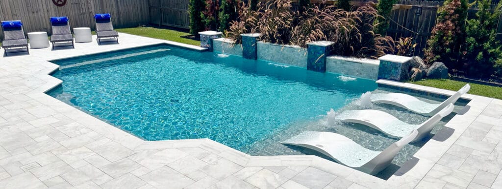 Custom swimming pool iwith large tanning ledge in Orange, Texas.