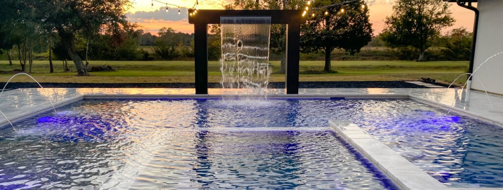 Rain curtain water feature on Beamont backyard pool.