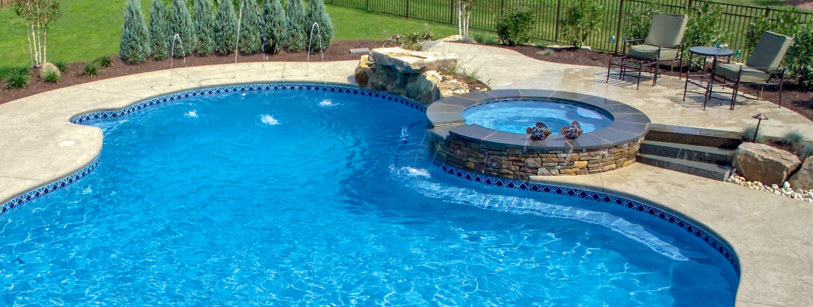 Harrisburg inground pool with elevated spa.