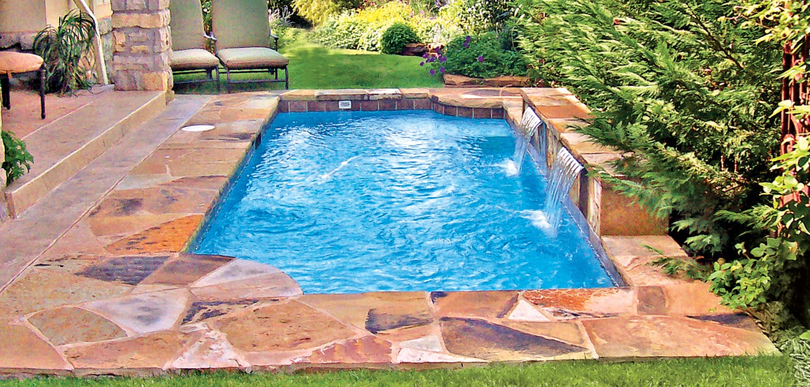 Rectangular-shaped pool with two inverted radius corners.