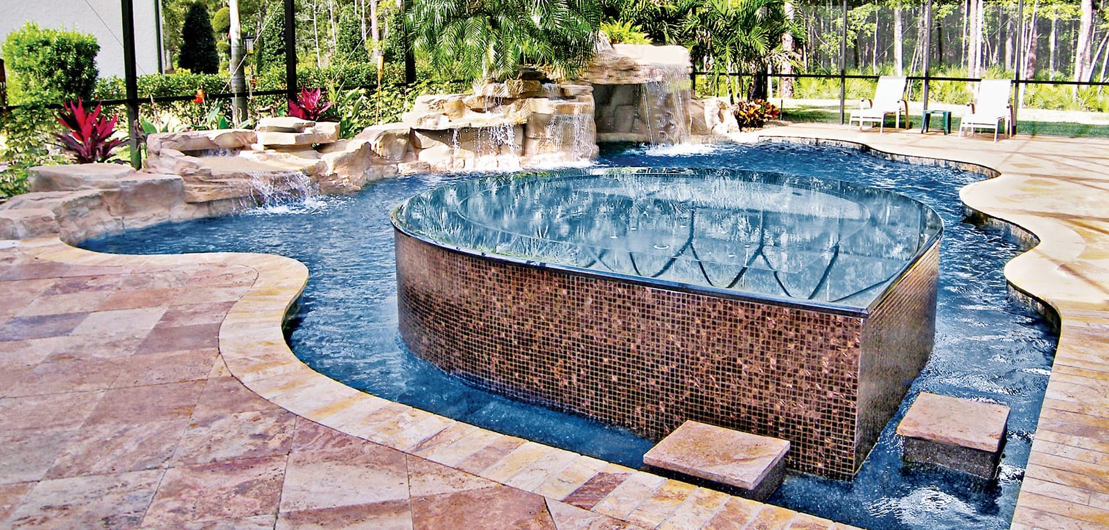 Tropical-style gunite pool with full-perimeter overflow spa in a screened room.