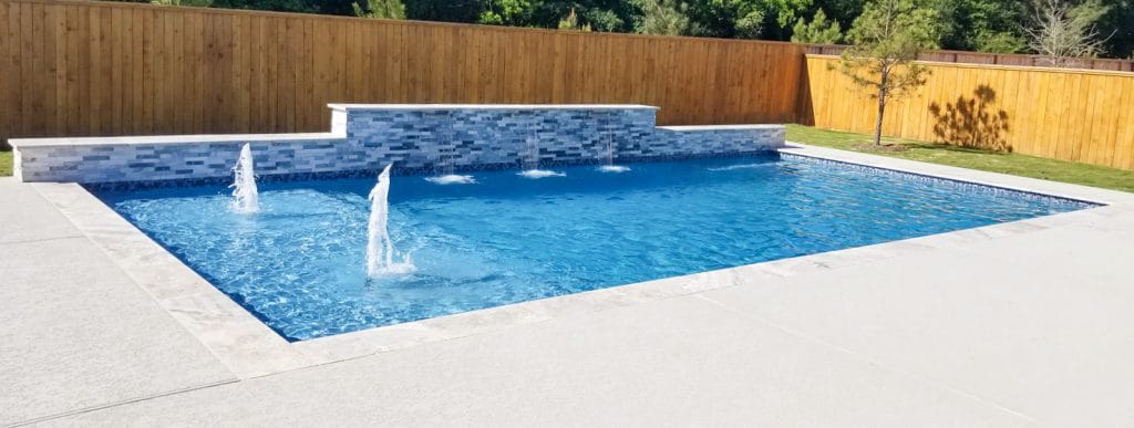 Rectangle-shaped pool with twin fountains in Clear Lake texas.