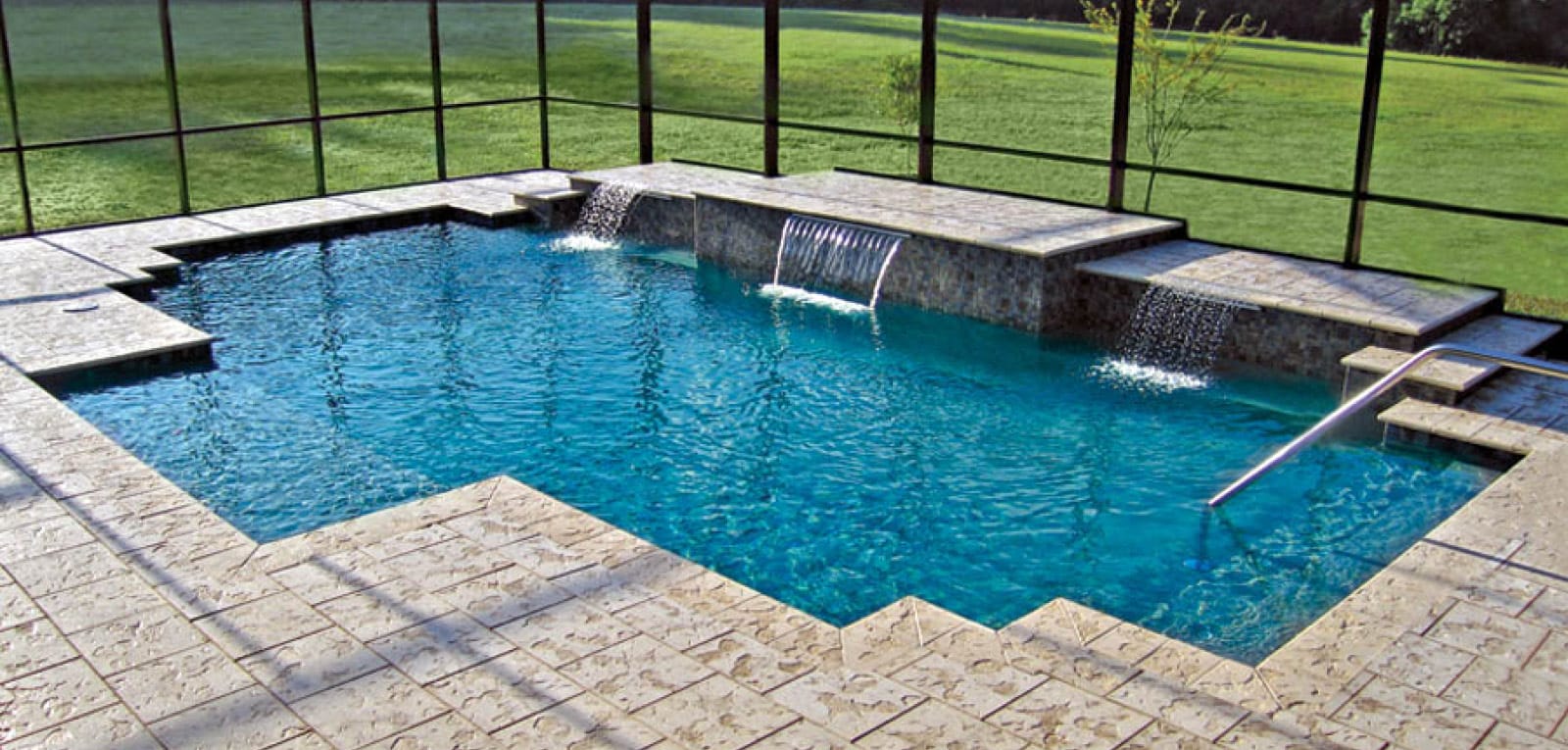 Inground pol with custom straight-edge shape and sleek water features.