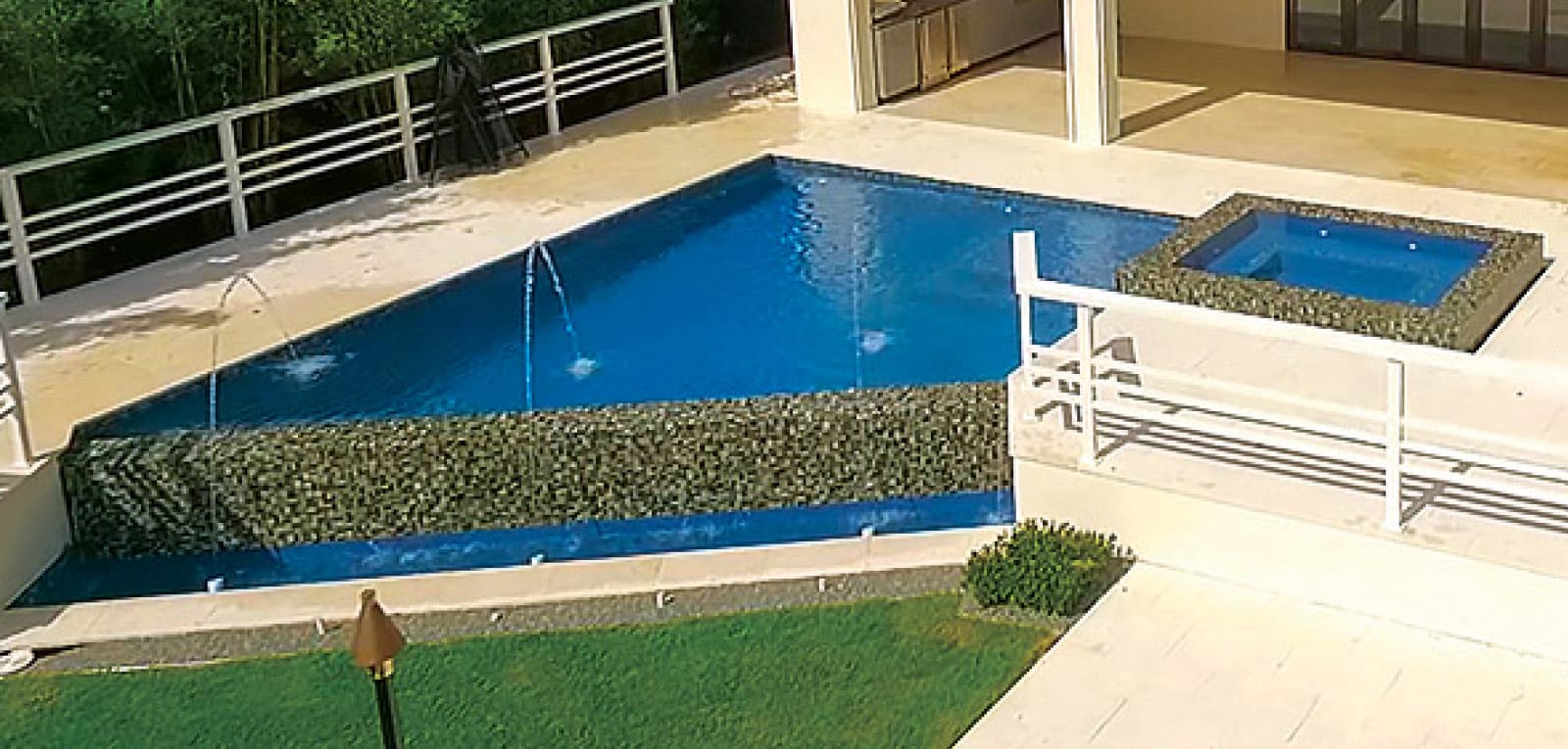 Angular infinity pool with spa and laminar water features.