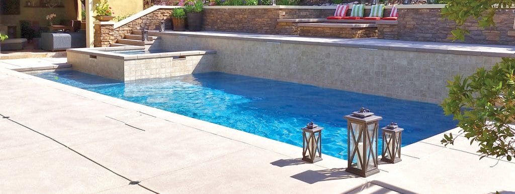 Rectangular gunite pool with square interior spa in San Diego.