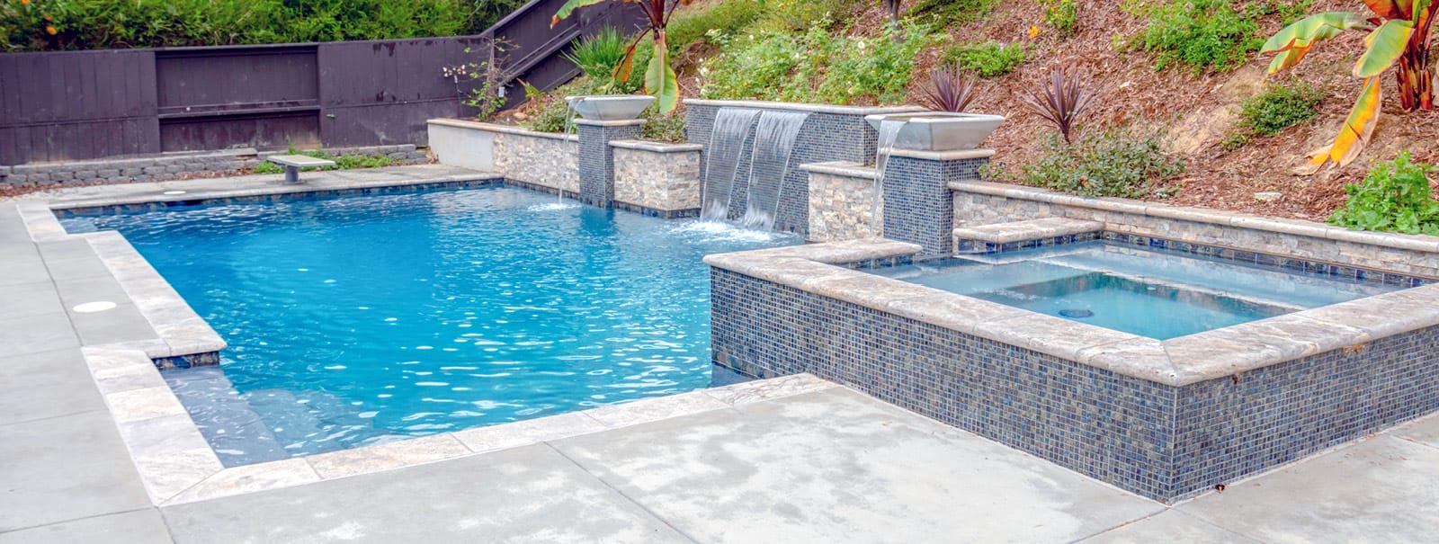 Geometric swimming pool with water bowls and spa in Scripps Ranch.