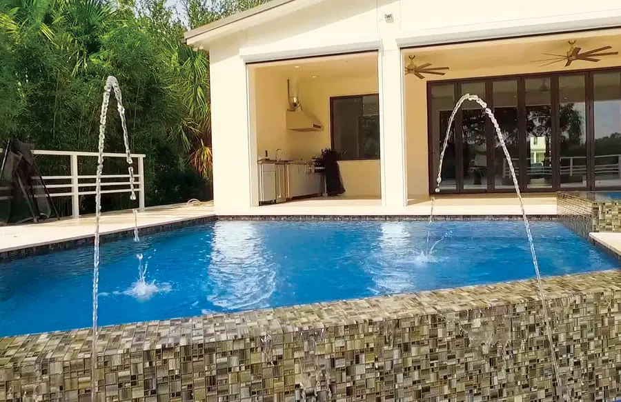 Laminar water feature on Palm Coast infinity pool.