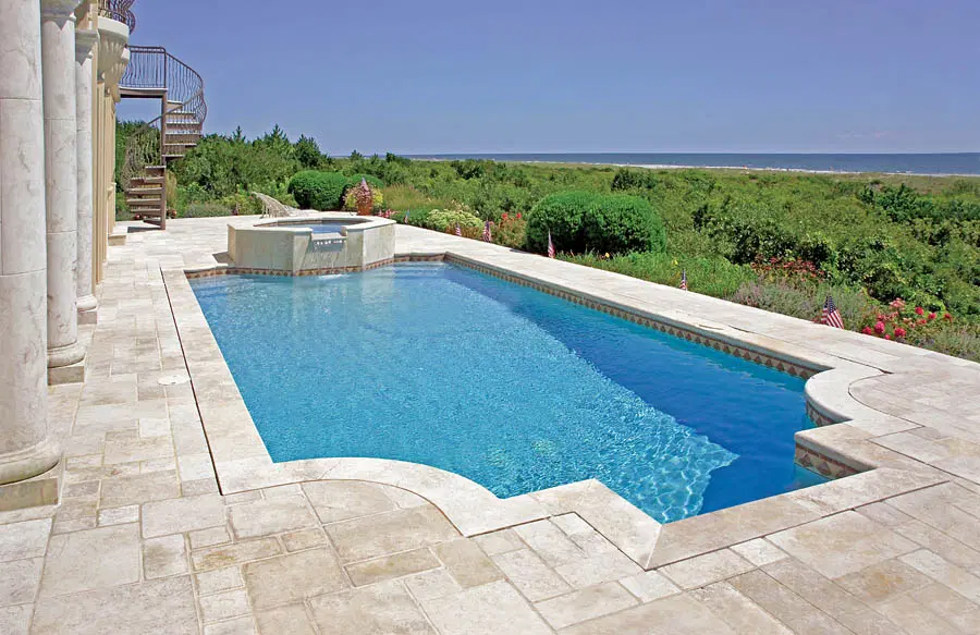 Modified Grecian-shaped custom pool in backyard on the coast.