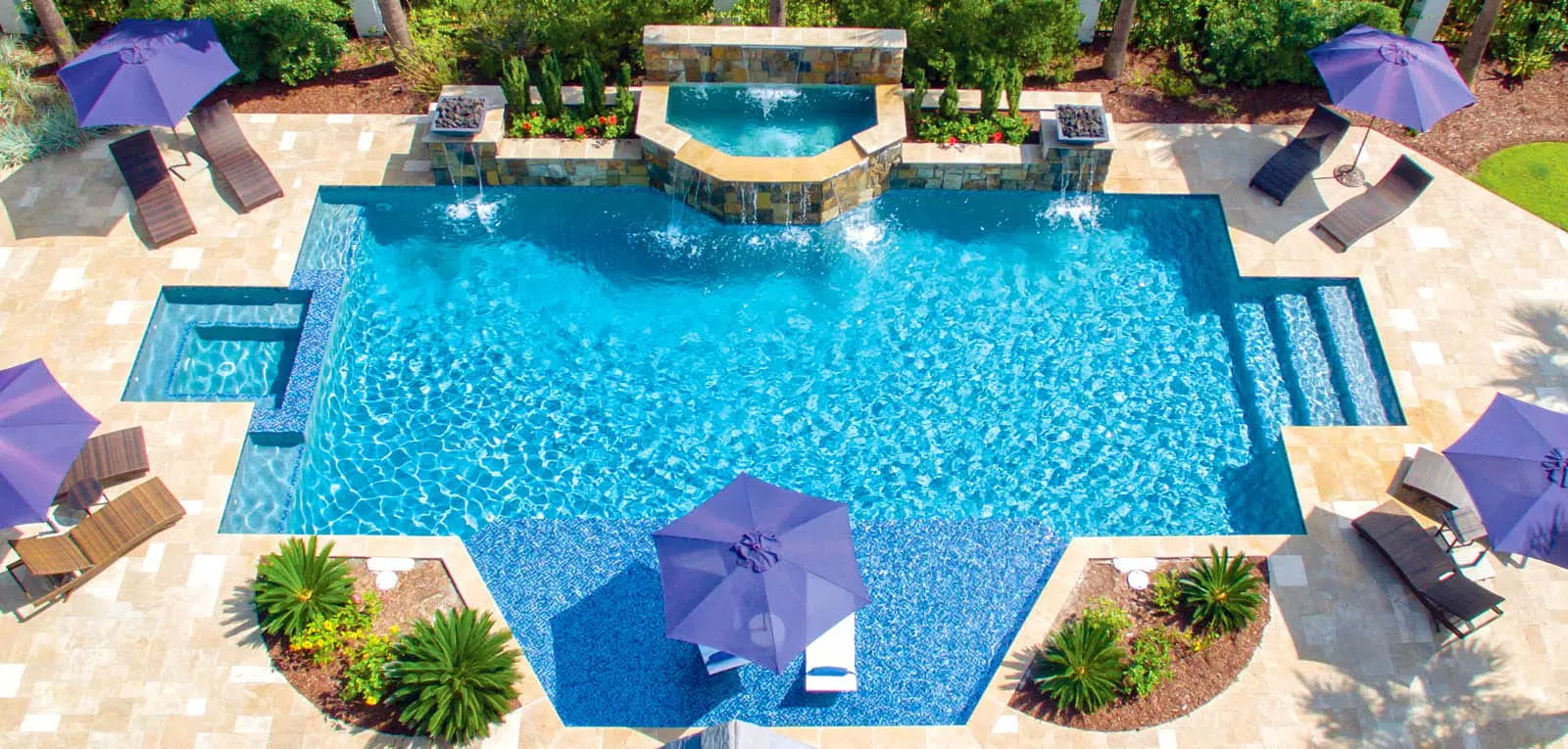 Elaborate custom geometric pools with integrated fountain and landscape enclosure.