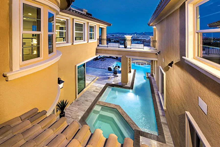 Summerlin inground pool nestled into courtyard of home.