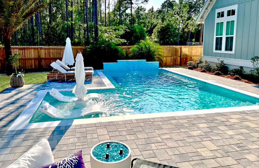 L-shaped gunite pool in Crestview backyard.