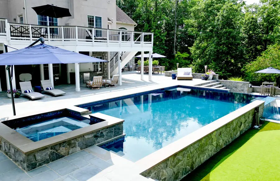 Rectangular inground pool in Fredericksburg backyard.