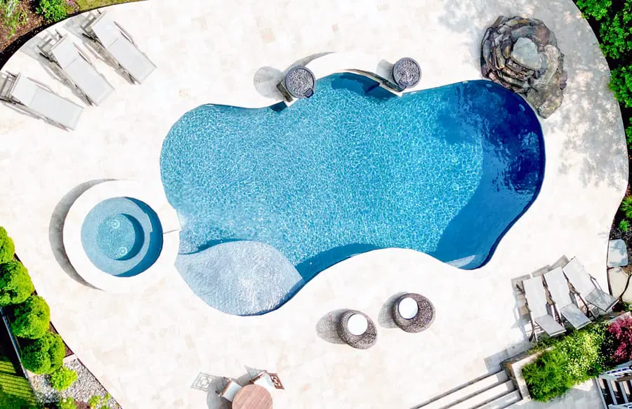 Overhead shot of Northern backyard with curvy gunite pool, Virginia with round spa.