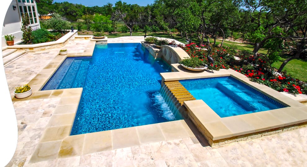 Modified rectangular pool with rectangle spa with channel style spillway.