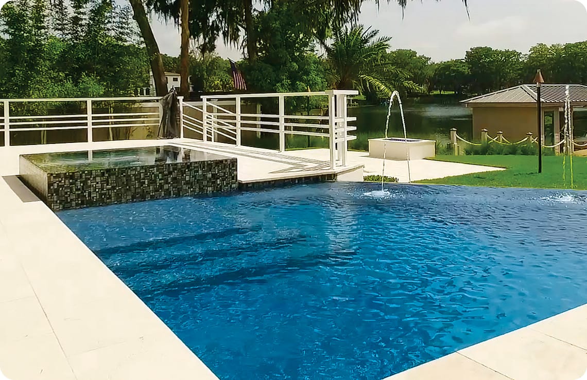 Modern pool with sleek, perimeter overflow spa and infinity edge.