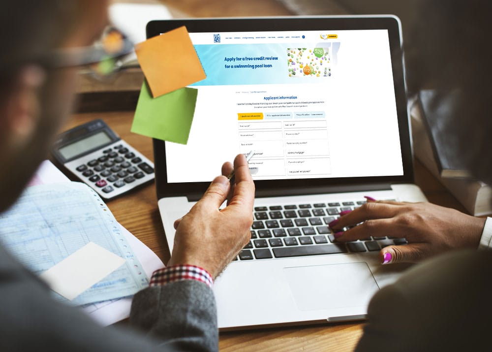 Completing an online credit application for pool loan.