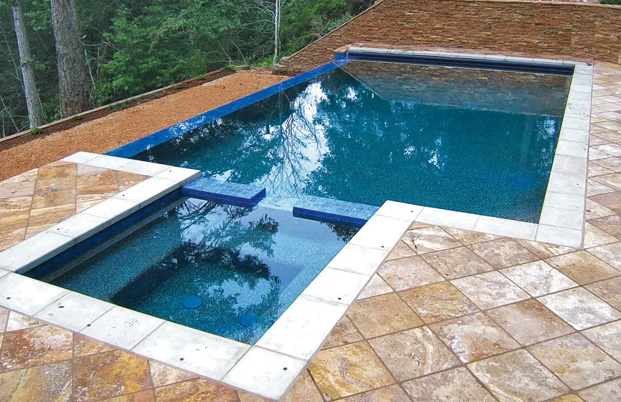 Infinity swimming pool with square spa.