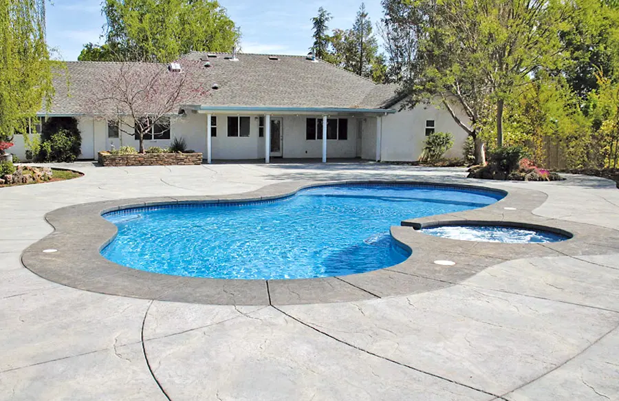 Curvy inground pool and spa in Chico.
