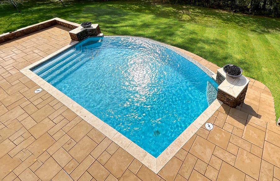 Infinity pool with twin set of fire bowls