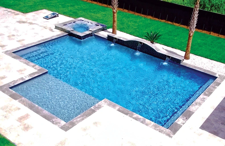 Inground pool with modified rectangular shape, square spa, and tanning ledge.