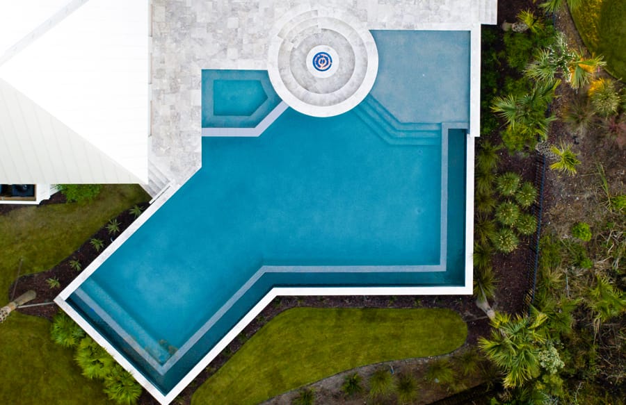 Geometric pool with angled interior spa.