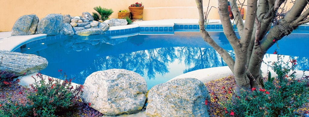 Tucson inground pool with accent boulders.