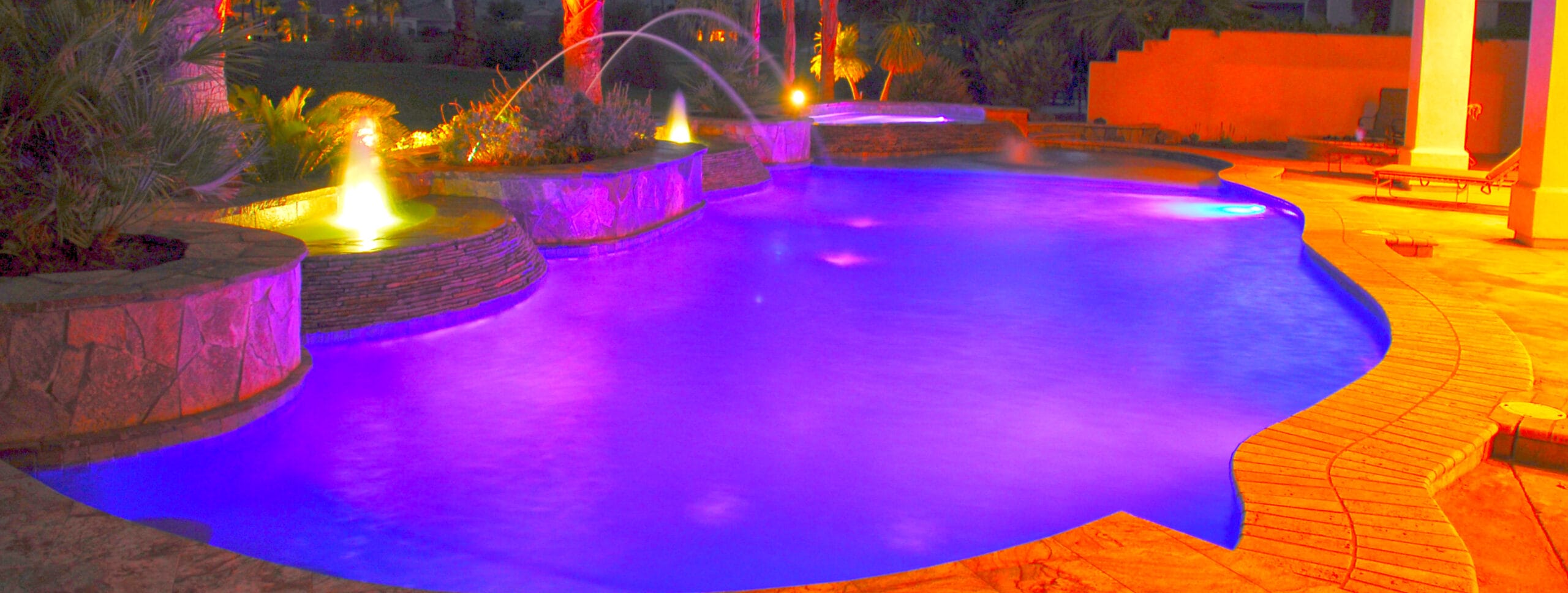 Swimming pool in Pima County illuminated at night.