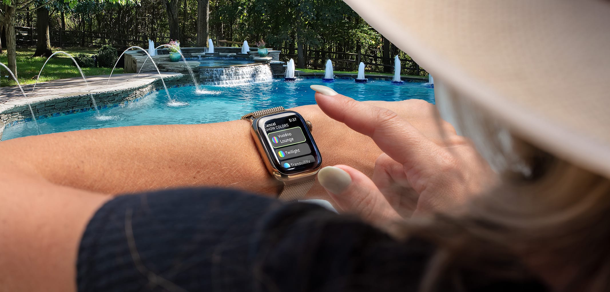 Woman using automation on smart watch to manage swimming pool features.
