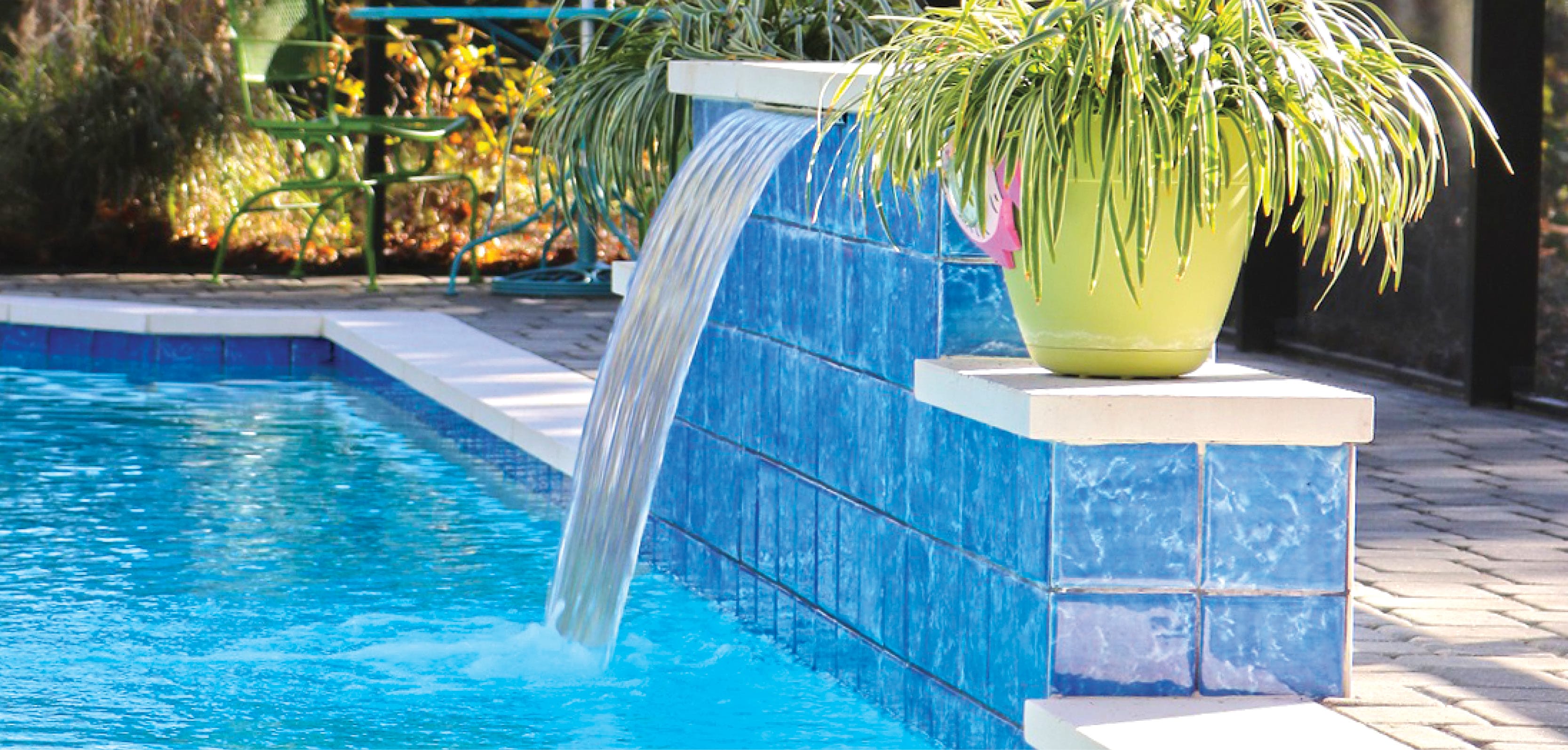 Cascade water feature on an inground swimming pool.